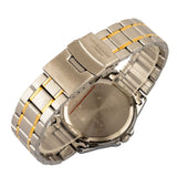 Close-up of a silver and gold watch band on a white background