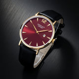 Watch with a red face and black strap on a light gray background