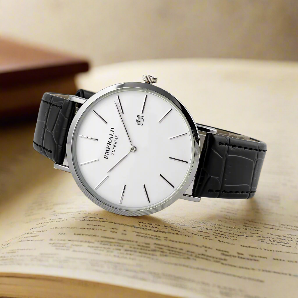 Wristwatch with black leather strap and white dial on a light gray background