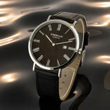 Watch on a wooden surface with a book, pen, and decorative elements.