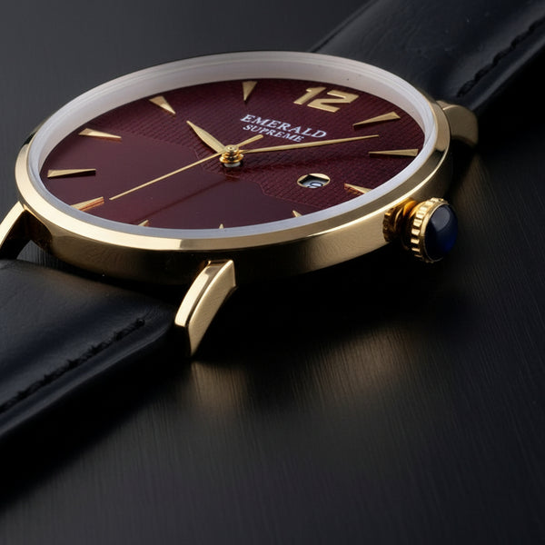 Luxury watch with gold case and black strap on a light gray background