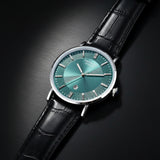 Watch with a green face and black strap on a white background
