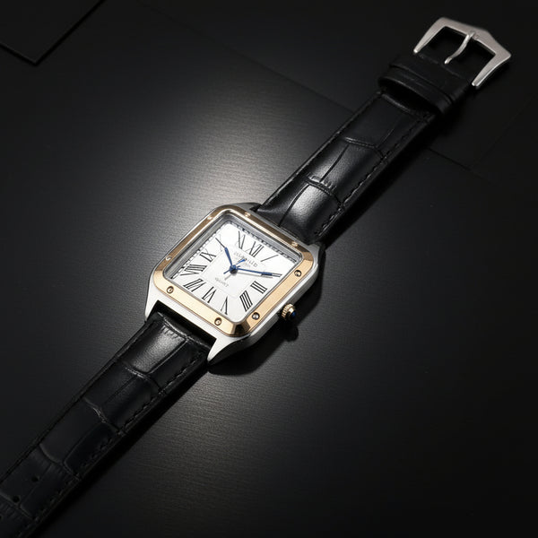 Watch with black strap and gold case on a white background