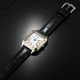 Watch with black strap and gold case on a white background