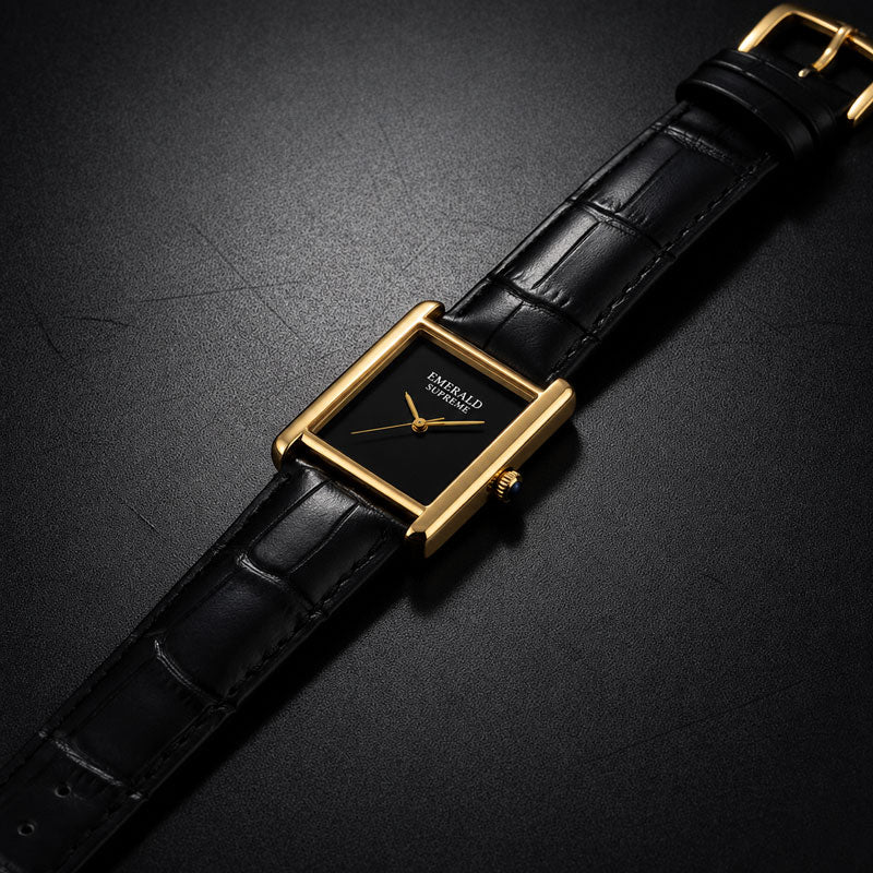 Close-up of luxury gold-tone watch with black dial and detailed case